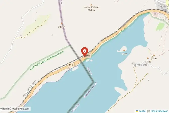 Close-up map showing a border crossing point with marker at the selected land port of entry between Albania and Montenegro