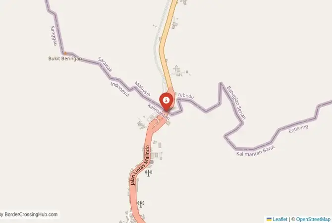 Close-up map showing a border crossing point with marker at the selected land port of entry between Indonesia and Malaysia