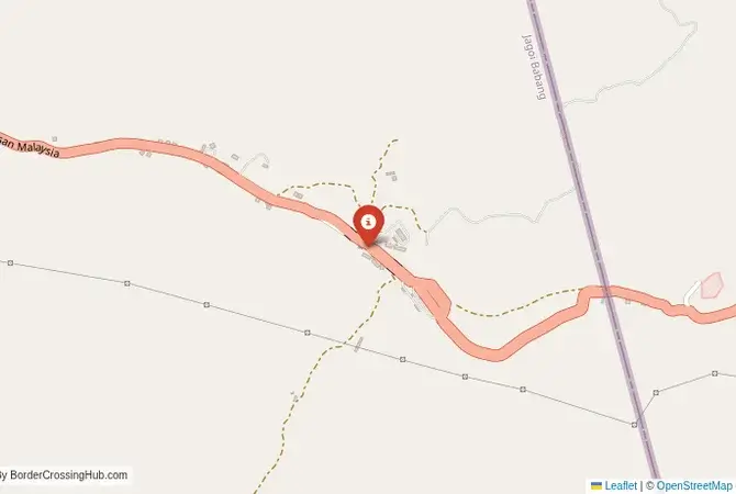 Close-up map showing a border crossing point with marker at the selected land port of entry between Indonesia and Malaysia