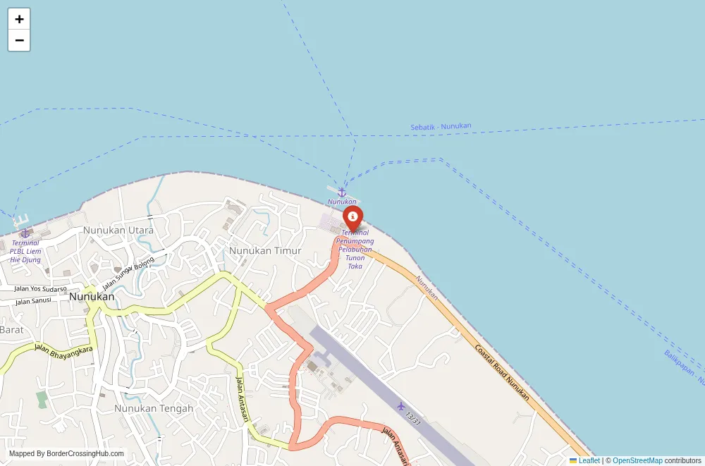 Close-up map showing a border crossing point with marker at the selected land port of entry between Malaysia and Indonesia